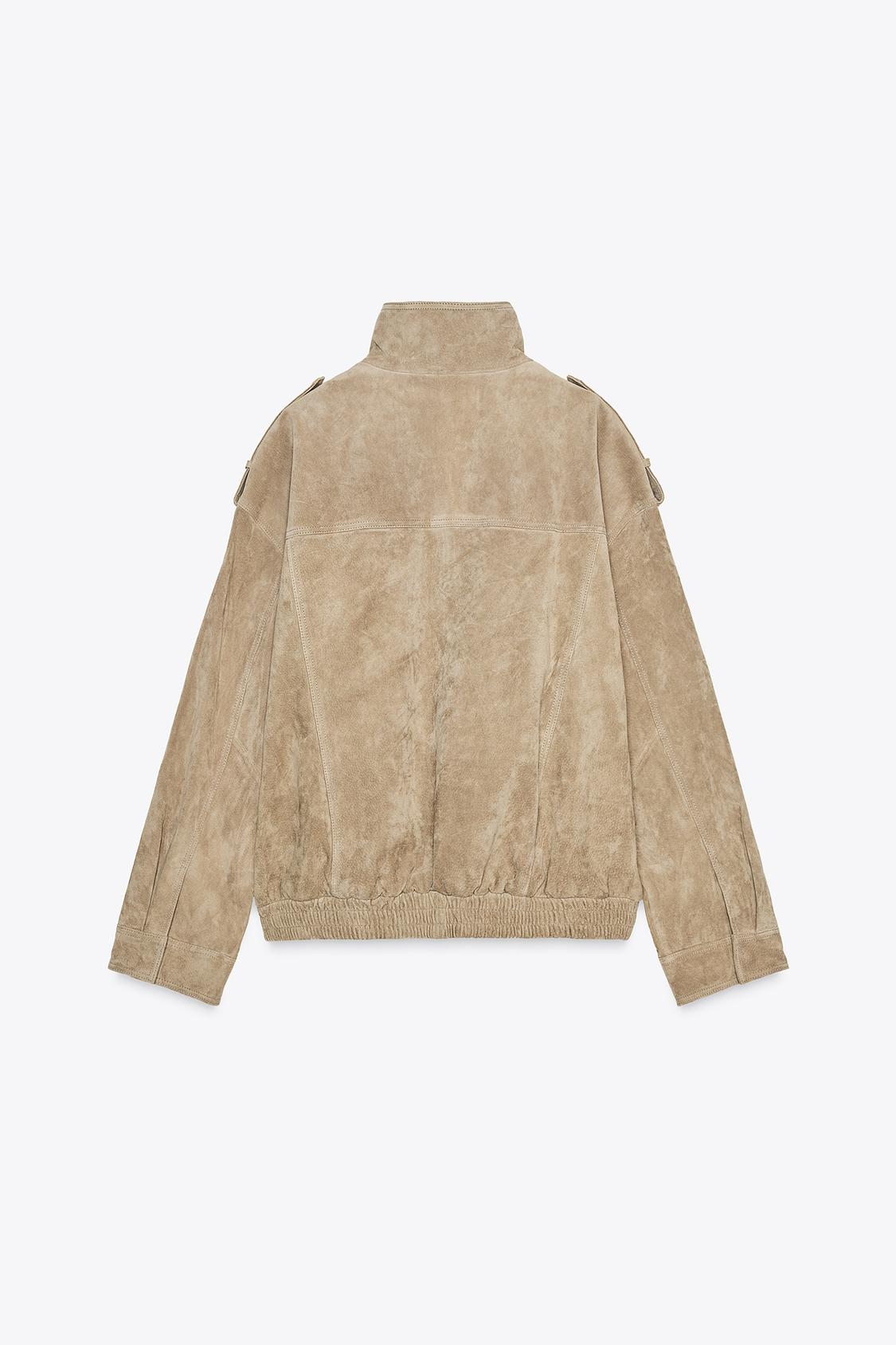 This Suede Jacket combines timeless sophistication with practical design. Crafted from soft suede leather, it features a high collar that provides extra warmth and a refined look. Long cuffed sleeves with shoulder tabs enhance its rugged appeal, while front and chest flap pockets offer convenient storage without sacrificing style. 