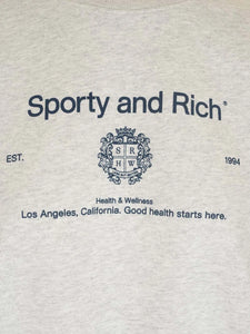 Elevate your casual wardrobe with the vintage-inspired Crewneck Sweatshirt! by Sporty & Rich Made from lightweight cotton, this loose-fitting sweatshirt features a unique round neck print and long sleeves. Perfect for a relaxed yet stylish look during the autumn season.