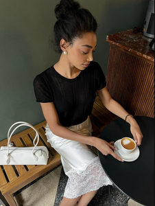 Elevate your wardrobe with the Margot Lace Skirt, an elegant satin piece designed for the modern professional woman. Featuring a high waist and graceful lace splice detail, this long skirt combines sophistication with comfort, ideal for summer wear. Its refined silhouette enhances your figure while maintaining a polished look suitable for any formal or business setting. The breathable satin fabric ensures all-day comfort, making it a versatile addition to your seasonal collection.