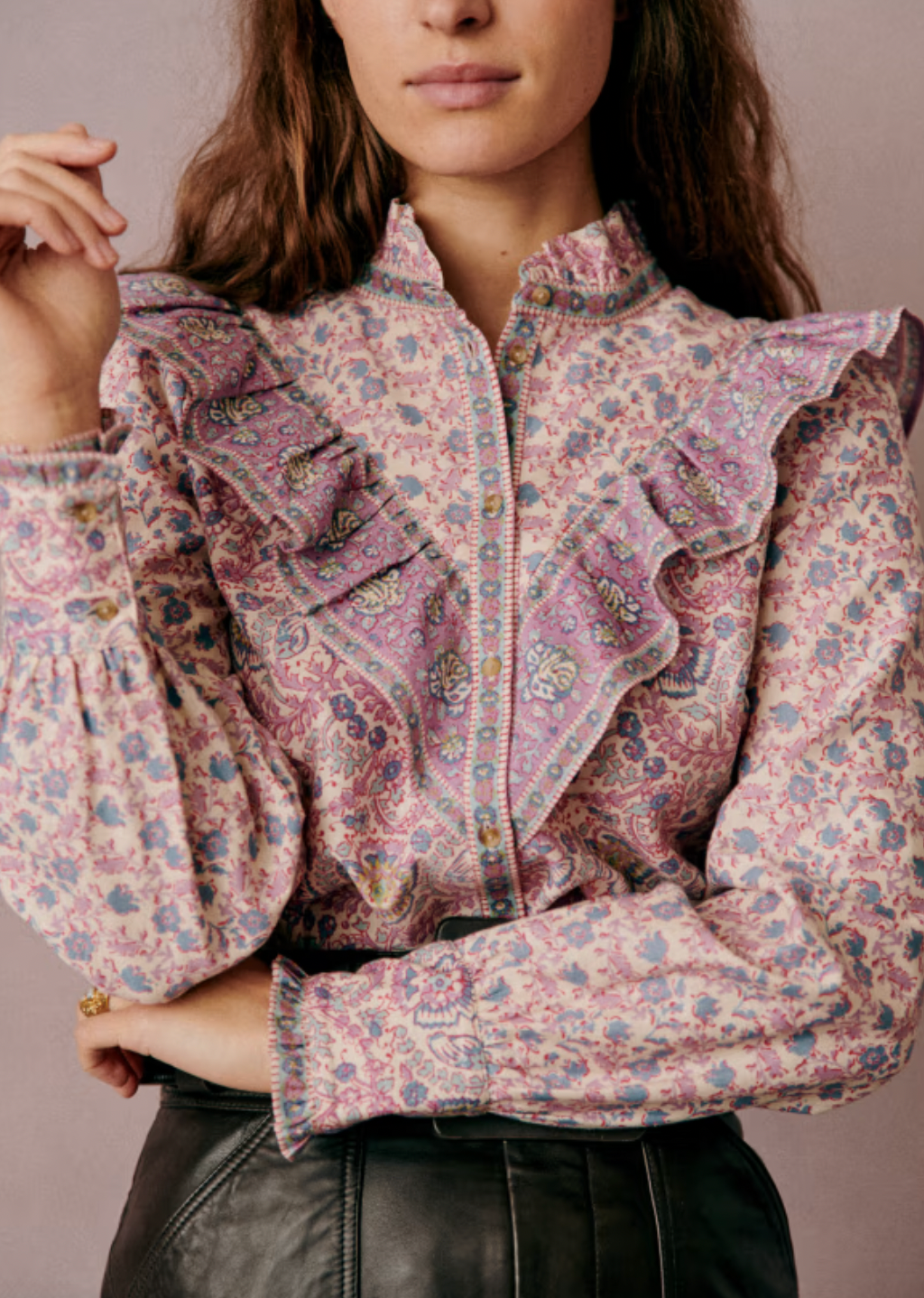 Elevate your wardrobe with the Gala Shirt by Sezane, featuring a gathered high collar that adds refined structure. Delicate ruffles cascade down the front, enhancing its elegant silhouette. The wide sleeves offer a modern, voluminous shape, expertly tailored with cuffs to provide a polished finish. This shirt combines classic detailing with contemporary design for a sophisticated, standout look.