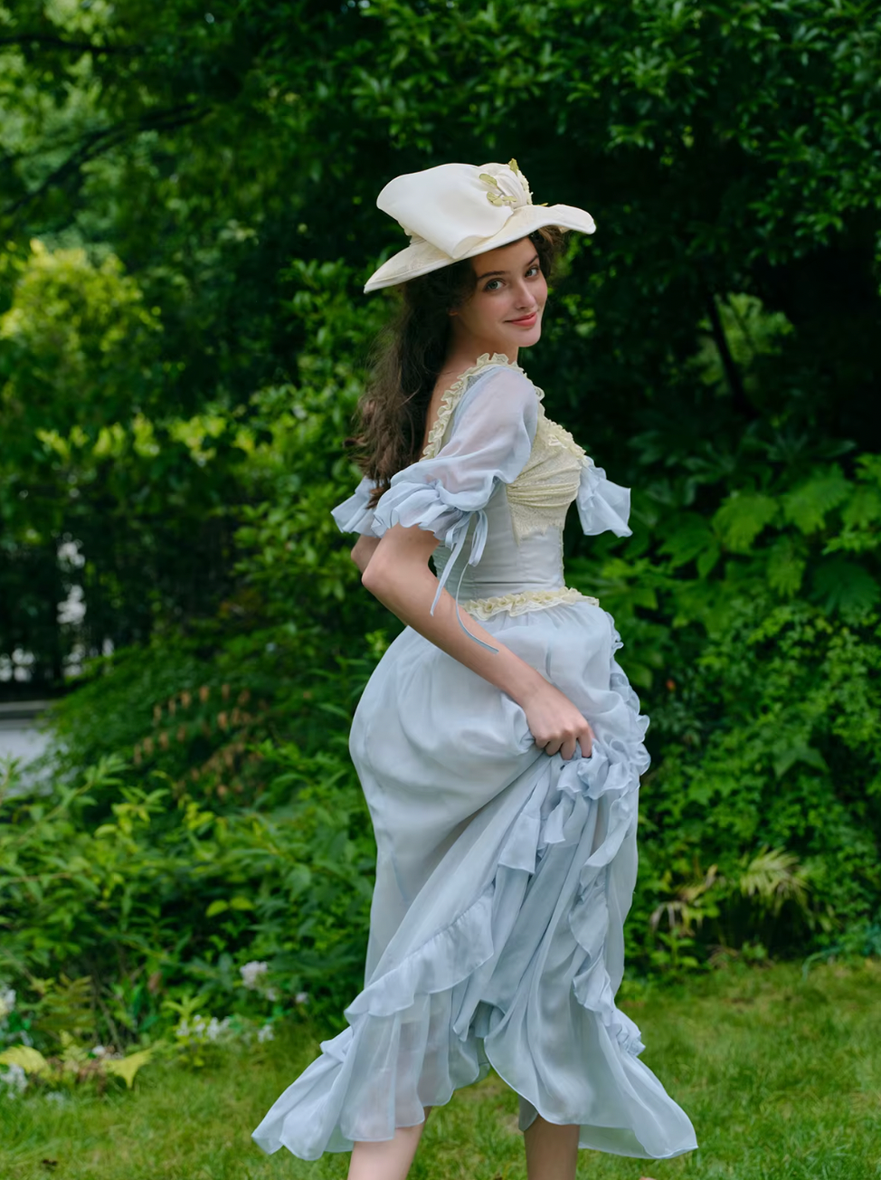 Introducing the Elora Dress - a vintage-inspired, slimming maxi dress in a sophisticated fishbone blue. With delicate lace accents and a seductive V-neck, this dress is perfect for summer parties and birthdays. Channel elegance and sexiness with every step in this exclusive piece.
