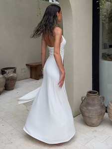 Indulge in luxury with the Jennifer Cupro Maxi Dress. Its plunging halter neckline and adjustable wire create an innovative and alluring look. The long clean lines and subtle cleavage expose exude sophistication. Perfect for any occasion, pair with embellished heels for a timeless and effortless ensemble.