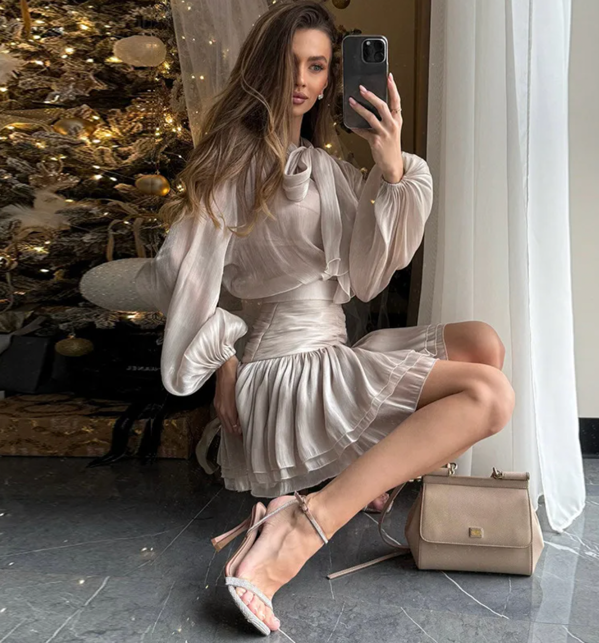 Elevate your wardrobe with the Melrose Shirt Dress, a refined dress featuring a backless blouse with a matching mini skirt. The blouse highlights a V-neckline and long lantern sleeves, adding a delicate yet striking touch. The accompanying A-line skirt offers a flattering silhouette, perfect for both day and evening occasions. This ensemble blends modern elegance with timeless charm, making it a sophisticated choice for confident women.