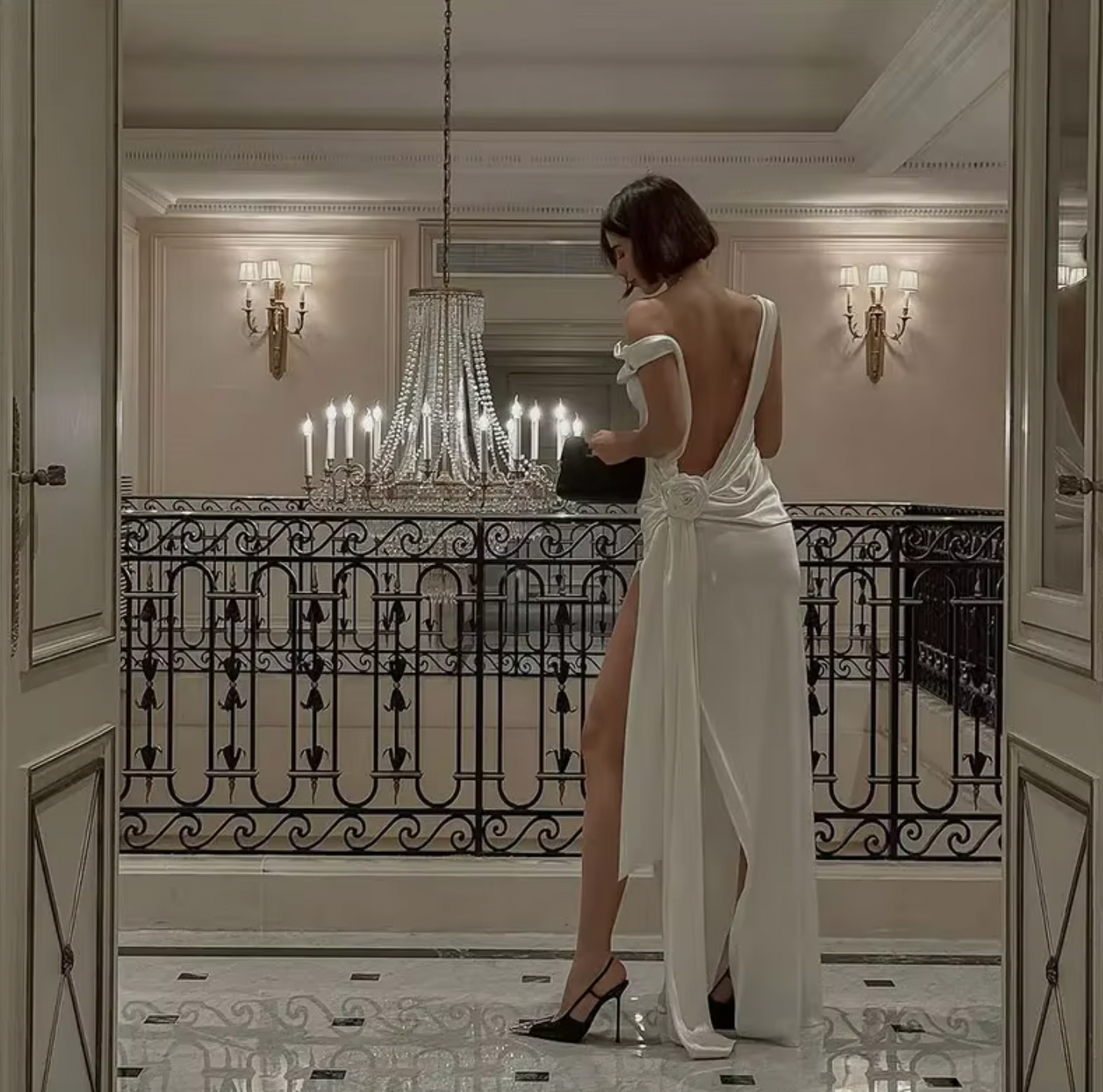 Indulge in luxury with the Darling Gown by DATT. Made from sumptuous silk, this gown exudes elegance. The back split adds a touch of allure while the intricate 3D rose embellishment elevates the design to a work of art. Perfect for those seeking a sophisticated and exclusive piece for their wardrobe.
