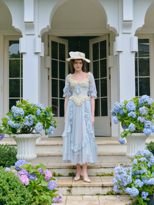 Introducing the Elora Dress - a vintage-inspired, slimming maxi dress in a sophisticated fishbone blue. With delicate lace accents and a seductive V-neck, this dress is perfect for summer parties and birthdays. Channel elegance and sexiness with every step in this exclusive piece.