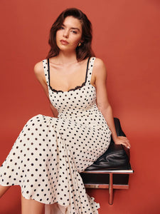 The Irisa Dress by Reformation features expert design details including back smocking and adjustable straps for a perfect fit. Its sweetheart neckline and back slit add subtle elegance, while the attached lace upper and back zipper ensure both style and practicality. Crafted from lightweight georgette with a dry handfeel, the dress is fully lined for comfort and modesty without sheerness. 