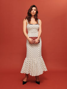 The Irisa Dress by Reformation features expert design details including back smocking and adjustable straps for a perfect fit. Its sweetheart neckline and back slit add subtle elegance, while the attached lace upper and back zipper ensure both style and practicality. Crafted from lightweight georgette with a dry handfeel, the dress is fully lined for comfort and modesty without sheerness. 
