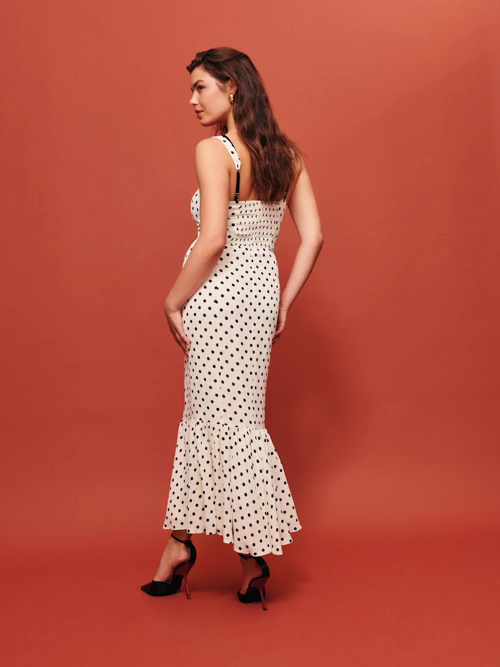 The Irisa Dress by Reformation features expert design details including back smocking and adjustable straps for a perfect fit. Its sweetheart neckline and back slit add subtle elegance, while the attached lace upper and back zipper ensure both style and practicality. Crafted from lightweight georgette with a dry handfeel, the dress is fully lined for comfort and modesty without sheerness. 