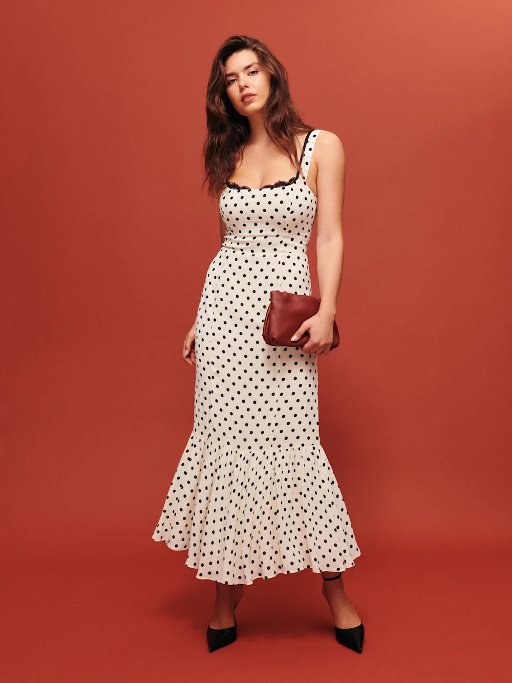 The Irisa Dress by Reformation features expert design details including back smocking and adjustable straps for a perfect fit. Its sweetheart neckline and back slit add subtle elegance, while the attached lace upper and back zipper ensure both style and practicality. Crafted from lightweight georgette with a dry handfeel, the dress is fully lined for comfort and modesty without sheerness. 
