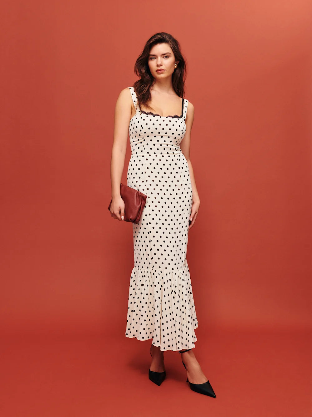 The Irisa Dress by Reformation features expert design details including back smocking and adjustable straps for a perfect fit. Its sweetheart neckline and back slit add subtle elegance, while the attached lace upper and back zipper ensure both style and practicality. Crafted from lightweight georgette with a dry handfeel, the dress is fully lined for comfort and modesty without sheerness. 