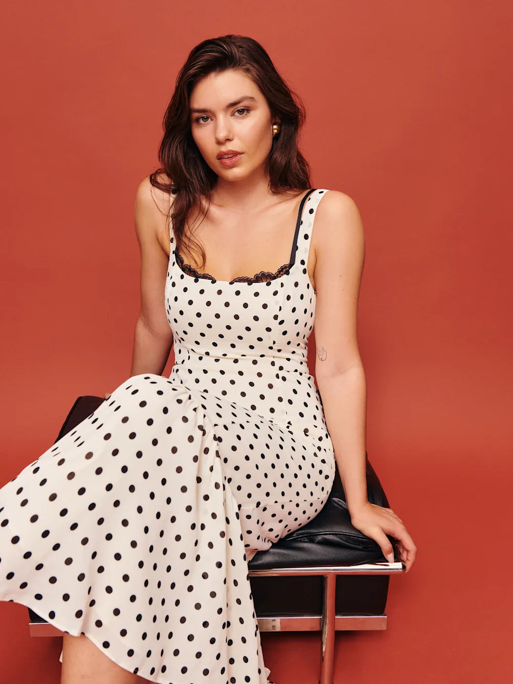 The Irisa Dress by Reformation features expert design details including back smocking and adjustable straps for a perfect fit. Its sweetheart neckline and back slit add subtle elegance, while the attached lace upper and back zipper ensure both style and practicality. Crafted from lightweight georgette with a dry handfeel, the dress is fully lined for comfort and modesty without sheerness. 