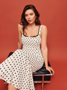 The Irisa Dress by Reformation features expert design details including back smocking and adjustable straps for a perfect fit. Its sweetheart neckline and back slit add subtle elegance, while the attached lace upper and back zipper ensure both style and practicality. Crafted from lightweight georgette with a dry handfeel, the dress is fully lined for comfort and modesty without sheerness. 