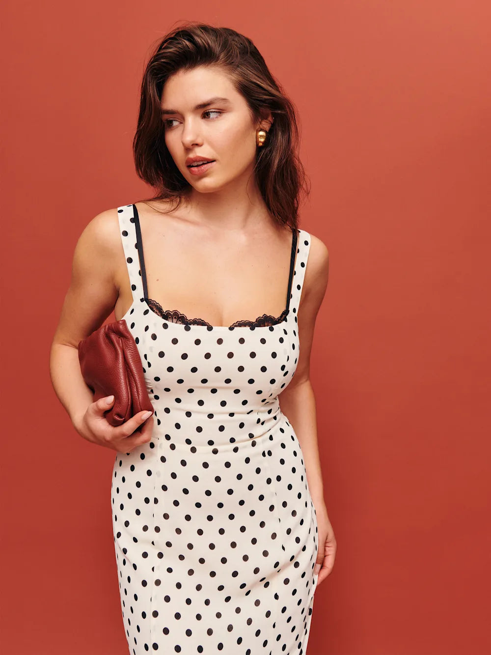 The Irisa Dress by Reformation features expert design details including back smocking and adjustable straps for a perfect fit. Its sweetheart neckline and back slit add subtle elegance, while the attached lace upper and back zipper ensure both style and practicality. Crafted from lightweight georgette with a dry handfeel, the dress is fully lined for comfort and modesty without sheerness. 