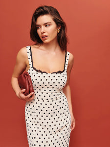 The Irisa Dress by Reformation features expert design details including back smocking and adjustable straps for a perfect fit. Its sweetheart neckline and back slit add subtle elegance, while the attached lace upper and back zipper ensure both style and practicality. Crafted from lightweight georgette with a dry handfeel, the dress is fully lined for comfort and modesty without sheerness. 