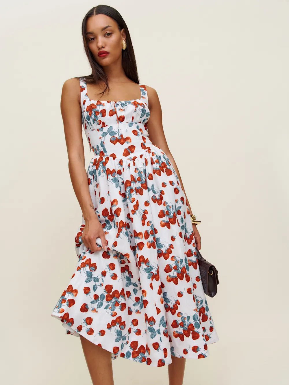The Balia Linen Dress in Strawberry Jam by Reformation offers a refined blend of comfort and style with its lightweight linen fabric, ideal for warm weather. Expertly designed with back smocking, it ensures a flexible fit while adjustable straps provide personalized comfort. The scoop neckline adds a flattering touch, and the dress is fully lined for a smooth feel. Practical side pockets enhance functionality without compromising elegance, making this piece a versatile staple for any sophisticated wardrobe.