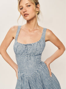 Introducing the Balia Linen Dress by Reformation! Embrace style and functionality with back smocking for a flattering fit, adjustable straps for comfort, and side pockets for convenience. The lined construction ensures a polished look without being sheer. Upgrade your wardrobe with this perfect summer dress!