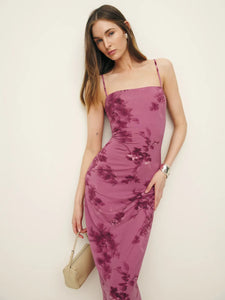 The Elise Knit Dress in Hothouse Rose by Reformation features adjustable straps and a straight neckline, combining customizable fit with classic style. Crafted from medium-weight, soft stretch jersey fabric, it offers comfortable wear with gentle flexibility, making it ideal for both casual and refined occasions. This dress balances structure and ease, ensuring a flattering silhouette throughout the day.