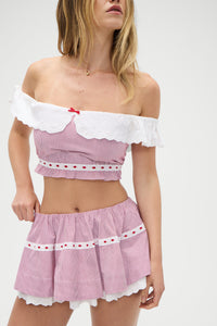 Indulge in the luxurious comfort and sophisticated style of the Darling Striped Skirt in Peppermint by Frankies Bikinis. Expertly crafted from soft washed poplin fabric, this two-tier skirt features a hidden elasticated waistband and delicate embroidered eyelet trim. Pair with the matching crop top for a chic and timeless look.