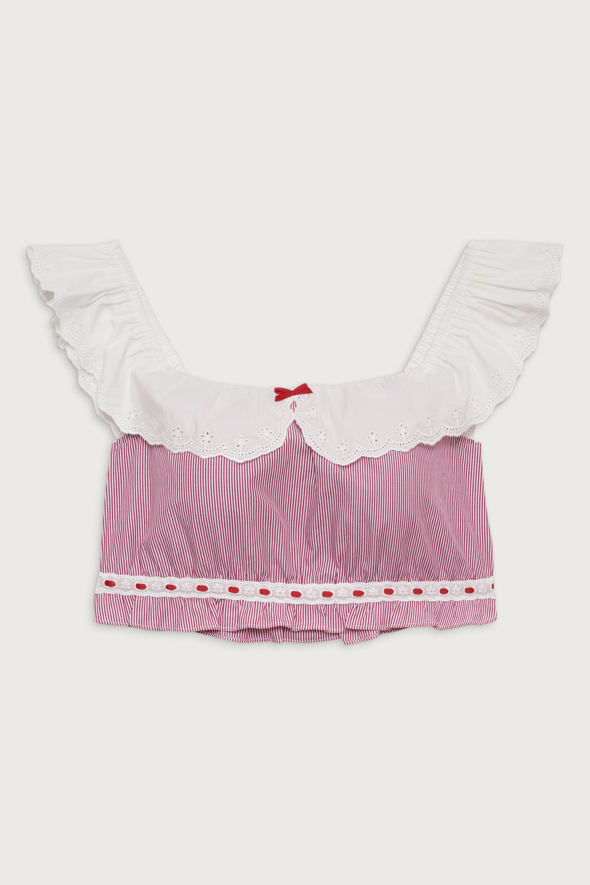 Indulge in the luxurious comfort and sophisticated style of the Darling Striped Skirt in Peppermint by Frankies Bikinis. Expertly crafted from soft washed poplin fabric, this two-tier skirt features a hidden elasticated waistband and delicate embroidered eyelet trim. Pair with the matching crop top for a chic and timeless look.