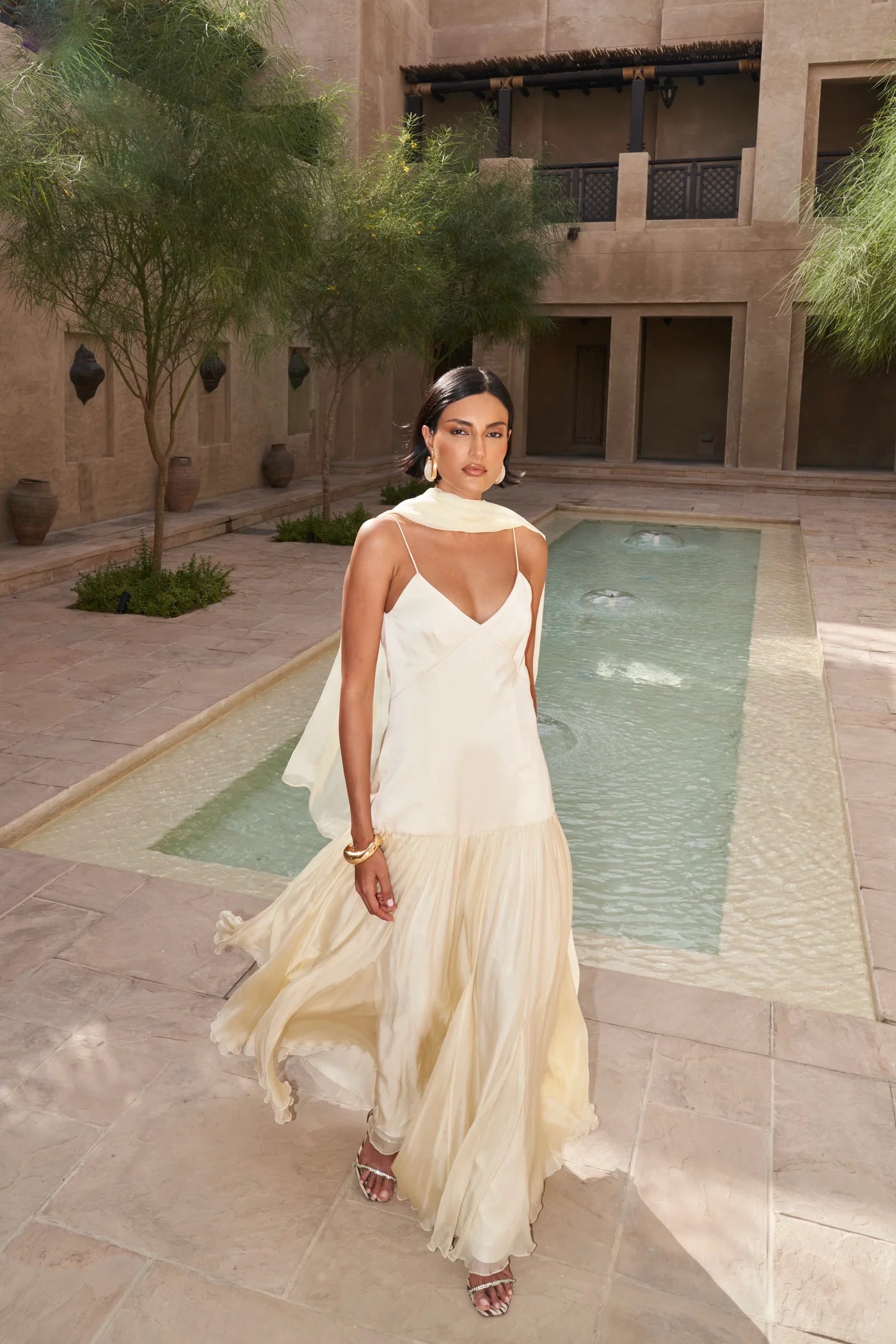 The Fia Maxi Dress embodies relaxed elegance with its timeless silhouette and flowing drop-waist design. Crafted to move gracefully with you, it drapes gently over the body for a flattering and effortless fit that never clings. Perfect for those seeking understated sophistication and comfort in one seamless piece.