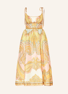 The Maxine Picnic Midi Dress by Zimmermann features a boned bodice with a smocked back for a tailored yet flexible fit. Crafted from lightweight linen, it ensures breathable comfort during warm days. The unlined design pairs with self-tie shoulder straps and a hidden back zipper closure for a sleek silhouette. Functional side seam pockets add practicality without compromising style, making this dress an expert choice for effortless, elegant summer wear.