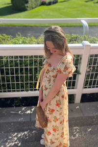 Get ready to feel like a princess in our Clarine Dress! This vintage inspired midi dress features delicate ruffles, a gathered bodice, and floaty chiffon fabric, all adorned with a charming all over roses print. With its romantic details and versatile wear, it's the perfect choice for any semi-formal event.