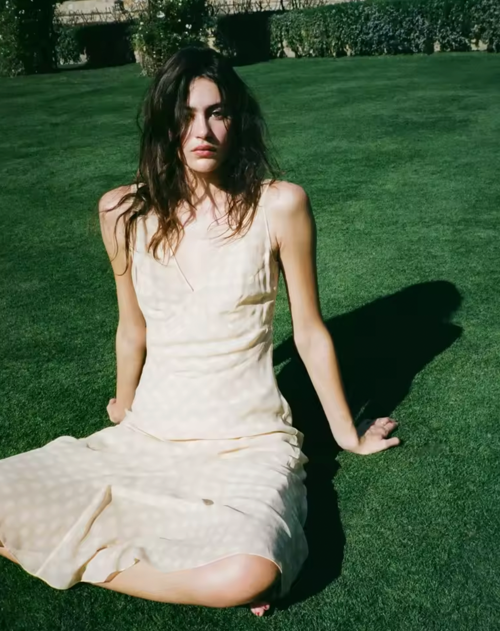 The Cleo Dress in Honey Spot by Realisation embodies effortless femininity with its light, floaty fabric and delicate sheer design. Featuring a flattering plunging V-neckline, sculpting panelled waist, and a fluted skirt that drapes gracefully, this dress is perfect for warm summer days and sultry evenings. The slightly shorter hemline adds a playful touch, while the removable underslip allows you to customize your look—opt for bold sheerness or a more refined silhouette. 