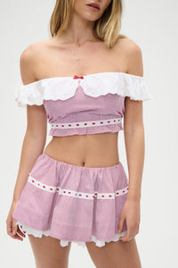 Indulge in the luxurious comfort and sophisticated style of the Darling Striped Skirt in Peppermint by Frankies Bikinis. Expertly crafted from soft washed poplin fabric, this two-tier skirt features a hidden elasticated waistband and delicate embroidered eyelet trim. Pair with the matching crop top for a chic and timeless look.
