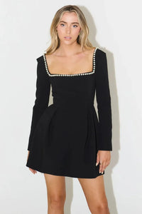 Indulge in luxury with the Pearl Mini Dress. Featuring a dramatic square neck line and a pearl trim from front to back, this dress is perfect for making a statement at any party. Elevate your style and confidence with this elegant and exclusive piece.