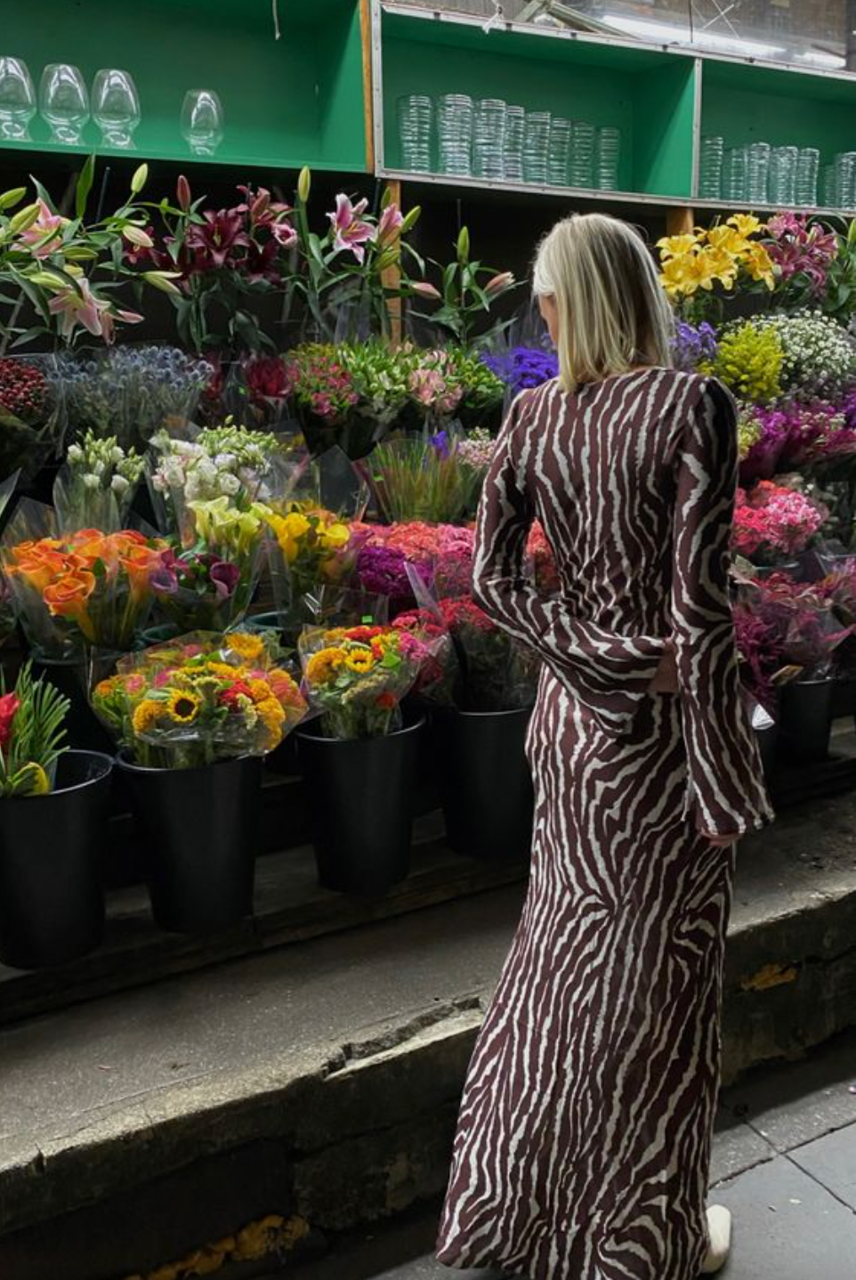 Indulge in the beauty of nature with the Zebra Maxi Dress! Featuring a beautiful floral print and transparent mesh detailing, this dress is perfect for any summer party. The round neckline and flowy design add a touch of elegance and fashion to your wardrobe. Elevate your style with this must-have dress!