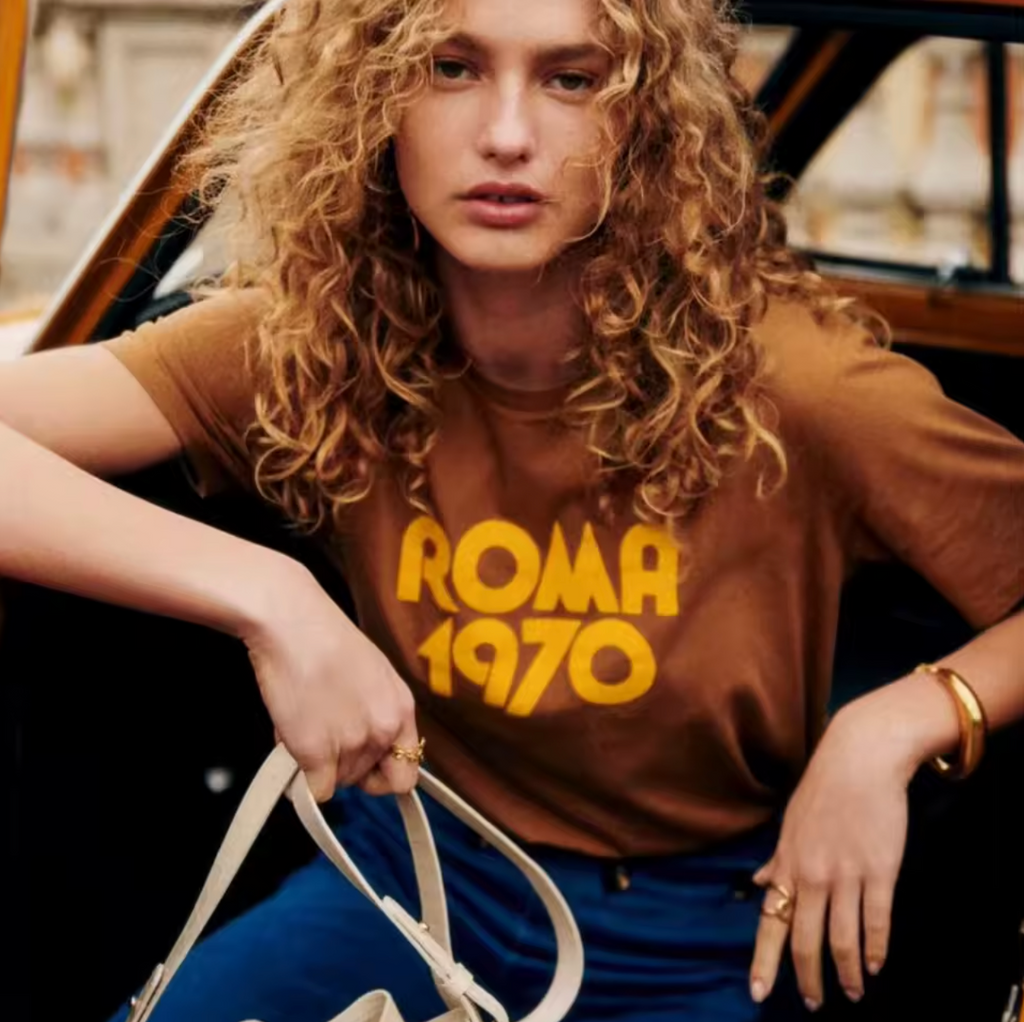 Elevate your casual wardrobe with the Roma 1970 Vintage T-Shirt—crafted from soft, breathable cotton for lasting comfort. Featuring a timeless brown hue and elegant letter-print design, this short-sleeve crewneck offers a relaxed fit that effortlessly blends vintage charm with modern sophistication. Ideal for women seeking understated style with a classic touch.