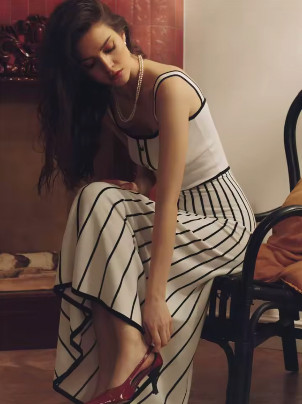 Elevate your evening with the Camille Midi Dress, a refined choice for sophisticated occasions. This slim, strapless design features contrasting stripes that artfully enhance its elegant silhouette. The backless cut adds a subtle allure, while the knit fabric ensures comfort and a flawless fit. Perfect for parties or upscale events, this dress combines modern style with timeless grace.