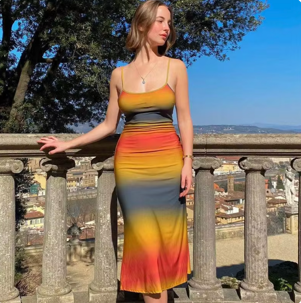 Introducing the Renata Slip Dress - the perfect blend of summer cool and effortless style. With a vibrant orange gradient color and low-cut spaghetti straps, this sleeveless dress is the perfect addition to your wardrobe. Let this dress take you from day to night with ease.