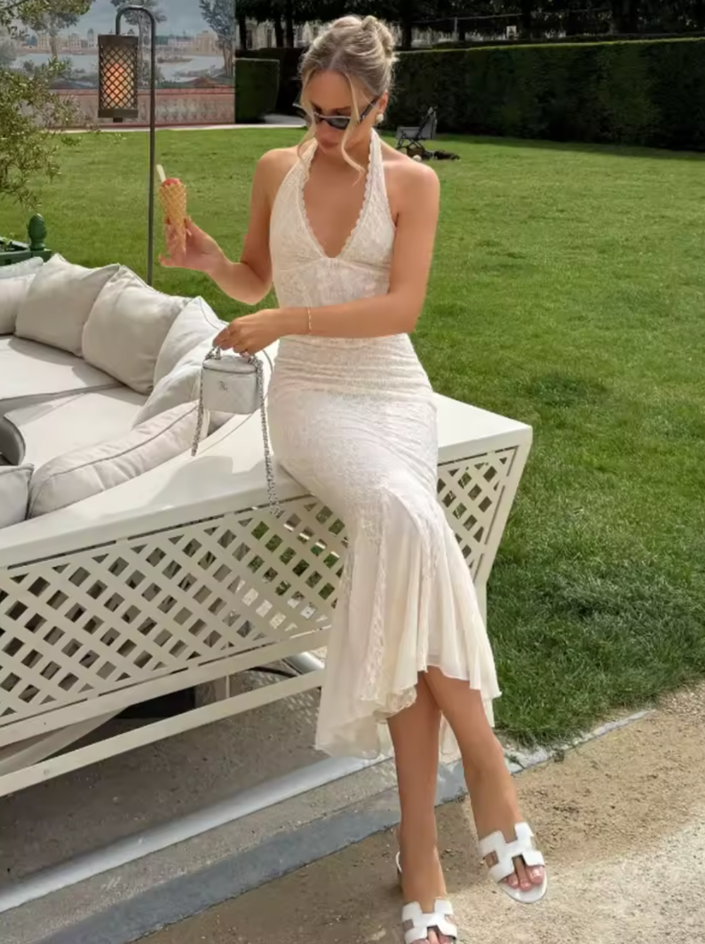 This halterneck corset lace dress combines elegance with allure through its deep V neckline and sleeveless, backless design. Crafted to accentuate the waist, the bodycon fit highlights your silhouette, while the fishtail hem adds a graceful, flowing finish. Perfect for sophisticated occasions, this long maxi gown offers a striking balance of classic lace details and modern shape.