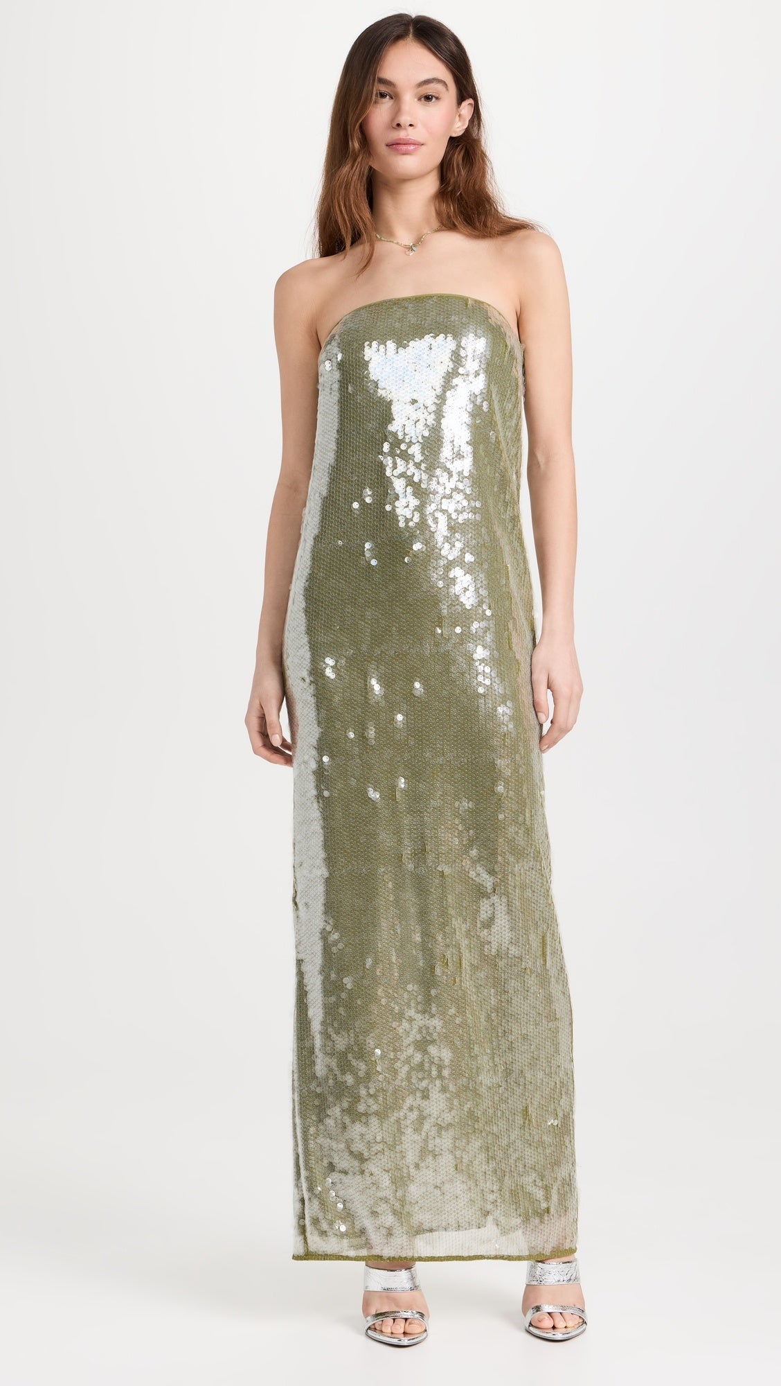 The Casey Dress by Staud combines contemporary elegance with practical sophistication. Crafted from mid-weight mesh, this strapless silhouette features allover iridescent paillette embellishments that catch light beautifully. The non-slip rubber binding ensures a secure fit, while the back slit adds movement and visual interest. Secured with a hidden zip and hook-and-eye closure for a seamless finish.