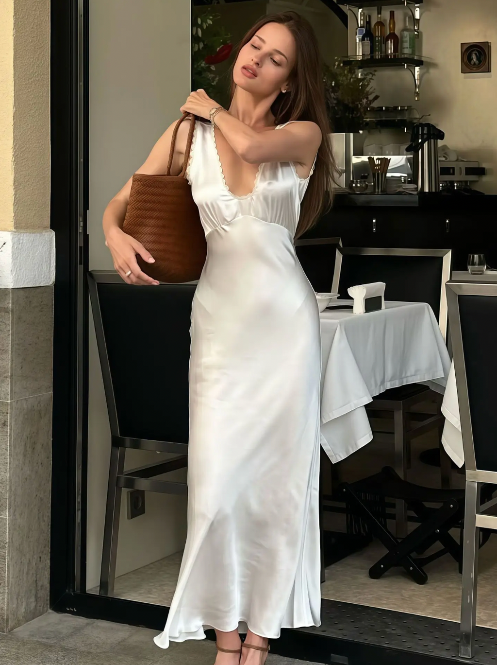 Elevate your evening look with the Allegra Satin Dress, a sleeveless, slim-fit gown designed to flatter your silhouette. Crafted from smooth satin, it features an elegant lace V-neckline and a high waist that enhances your figure. Perfect for sophisticated parties and special occasions, this dress combines timeless style with a touch of sensuality for a truly captivating presence.