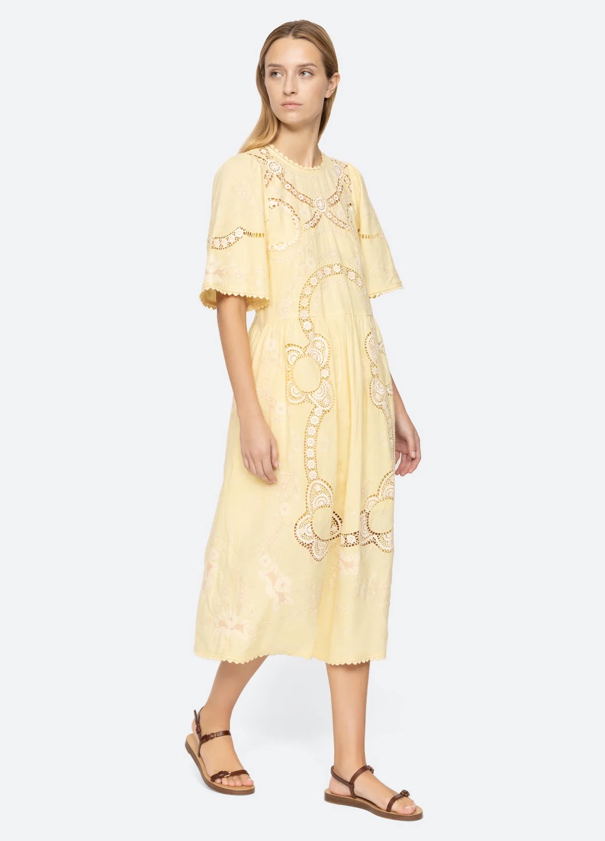 Elevate your wardrobe with the Vesna Embroidered Midi Dress by SEA NY, featuring delicate embroidery and scalloped trim for a refined finish. Its crew neckline and short sleeves complement the flattering A-line silhouette, while the hem gracefully falls below the knee. The back tie closure offers a tailored fit, combining elegance with comfort. Crafted from a cotton, linen, and polyester blend, this dress is best maintained with dry cleaning to preserve its quality. Perfect for sophisticated occasions.