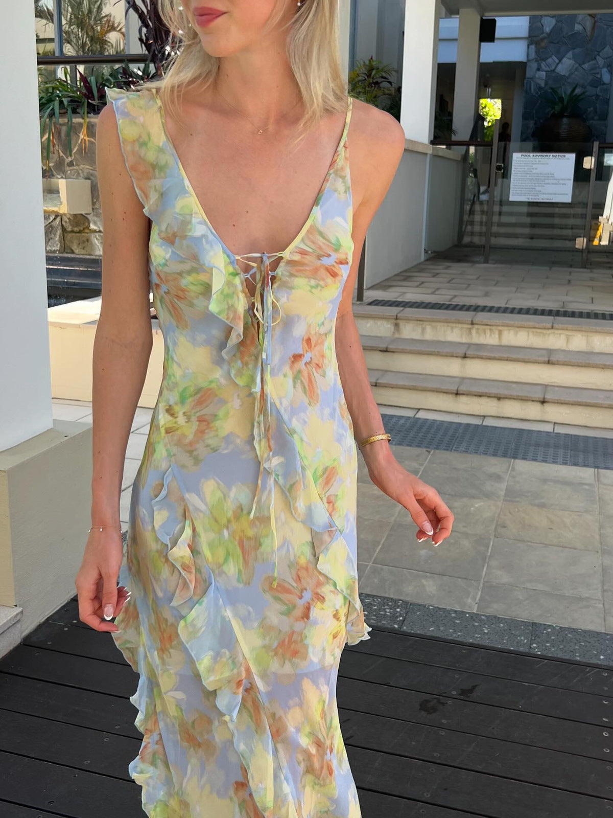 Crafted from lustrous silk print fabric and cut on the bias, the Courtney Frill Maxi Dress by Bec + Bridge embodies sophisticated ease. This statement piece showcases a plunging V-neckline, asymmetrical raw-cut shoulder detail, and artfully placed raw-cut ruffles that create movement and visual interest. The lace-up front closure and open V-back add architectural intrigue, making this an ideal choice for those seeking refined elegance with contemporary edge.