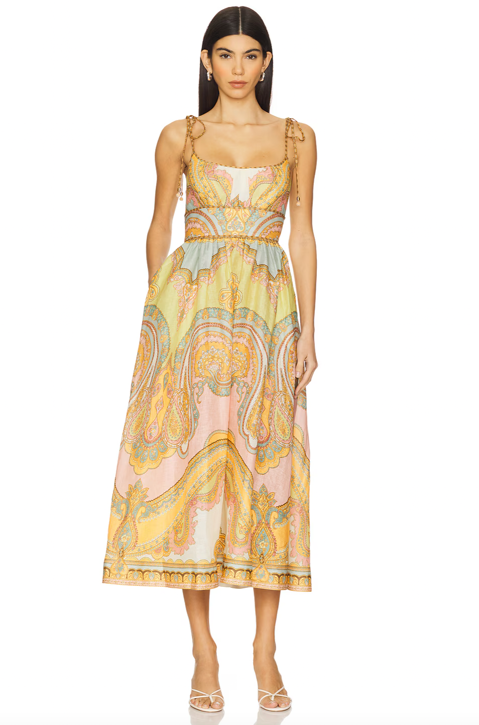 The Maxine Picnic Midi Dress by Zimmermann features a boned bodice with a smocked back for a tailored yet flexible fit. Crafted from lightweight linen, it ensures breathable comfort during warm days. The unlined design pairs with self-tie shoulder straps and a hidden back zipper closure for a sleek silhouette. Functional side seam pockets add practicality without compromising style, making this dress an expert choice for effortless, elegant summer wear.