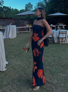 Embrace elegance with the Orfila Manila Maxi Dress, featuring a strapless floral print that captures the essence of summer sophistication. Its sleeveless, backless design paired with a flowing silhouette offers a flattering, graceful fit perfect for beach parties or evening events. Complete with a coordinating scarf, this dress combines comfort and style for unforgettable holiday moments.