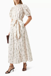 Defined by a fit-and-flare silhouette, the Adaline dress is finished with voluminous puffed sleeved. Cut from crisp cotton, the elegant silhouette features soft pleats throughout the top, a self-tie waist and pockets for keeping a lip gloss and card holder.