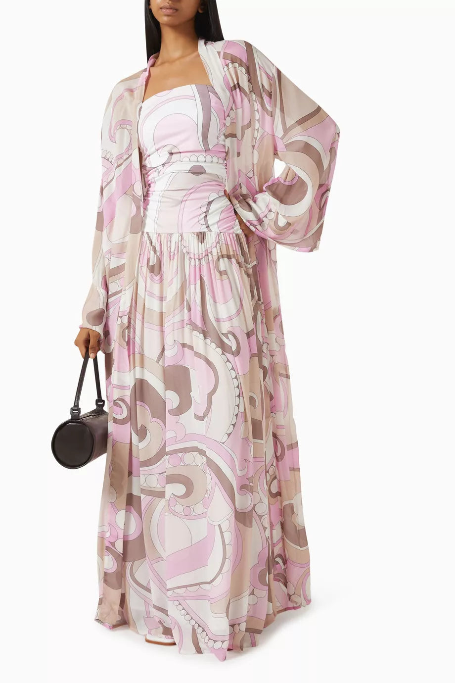 The Mode Maxi Dress by Cin Cin embodies timeless elegance with its captivating print and fluid silhouette. Designed with a ruched bodice and a refined strapless neckline, this dress offers a flattering fit that enhances your natural grace. Perfect for sophisticated occasions, it combines comfort and style to ensure you leave a lasting impression.