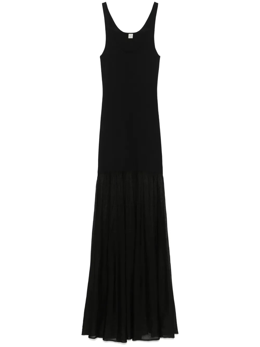 This black evening maxi dress by Toteme combines refined craftsmanship with elegant design. Crafted from fine knit fabric, its panelled construction offers a structured silhouette that flatters the figure. The scoop neck and sleeveless cut contribute to a sleek, timeless look, while the unlined design ensures comfortable wear throughout the evening. The flared skirt extends into a flowing, long length, making it an impeccable choice for formal events that demand both style and sophistication.