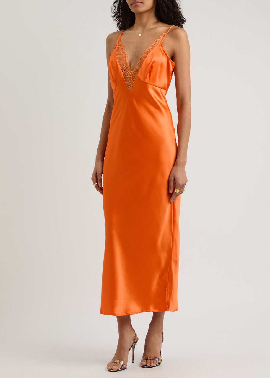The Caetana dress combines sophistication and allure with adjustable shoulder straps and a plunging V-neck that enhances your silhouette. Detailed with scalloped eyelash lace trim and side splits at the hem, this dress adds a delicate, feminine touch while allowing graceful movement. Perfect for making a memorable impression at any event.