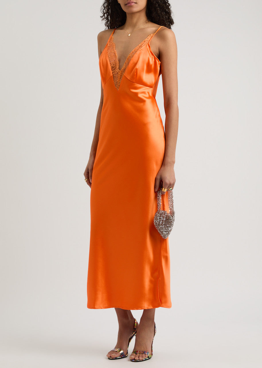 The Caetana dress combines sophistication and allure with adjustable shoulder straps and a plunging V-neck that enhances your silhouette. Detailed with scalloped eyelash lace trim and side splits at the hem, this dress adds a delicate, feminine touch while allowing graceful movement. Perfect for making a memorable impression at any event.