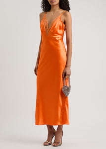 The Caetana dress combines sophistication and allure with adjustable shoulder straps and a plunging V-neck that enhances your silhouette. Detailed with scalloped eyelash lace trim and side splits at the hem, this dress adds a delicate, feminine touch while allowing graceful movement. Perfect for making a memorable impression at any event.