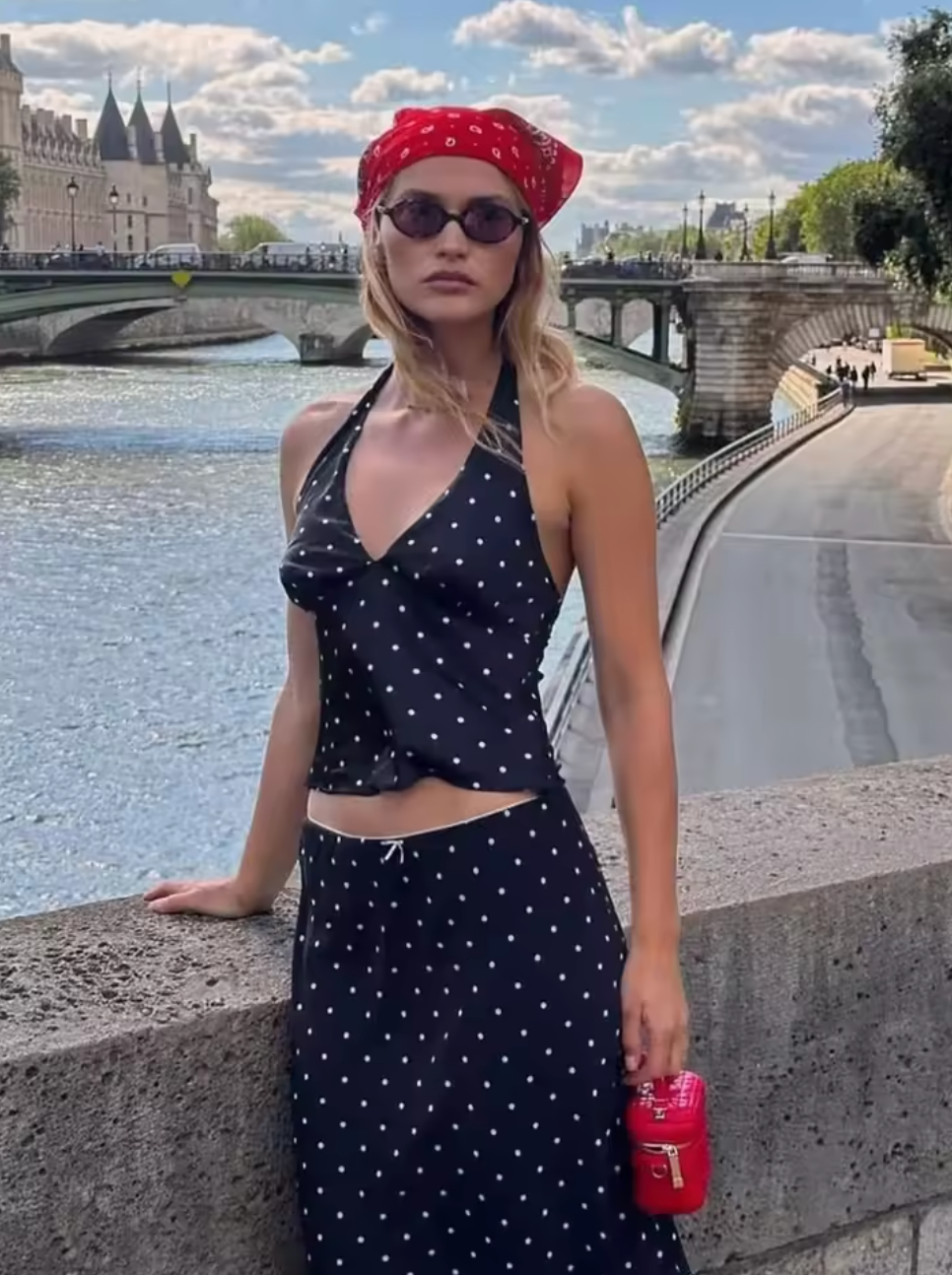 Embrace timeless elegance with the Iris Set, a vintage-inspired two-piece ensemble perfect for summer. Featuring a V-neck halter top paired with a straight skirt, this polka dot outfit blends retro charm with modern sophistication. Ideal for beach outings or stylish daywear, it offers both comfort and grace, ensuring you make a confident statement wherever you go.