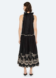 The Kingsley embroidered tank dress by SEA NY showcases intricate embroidery throughout its design, offering a refined and elegant appeal. It features a high neckline that adds a sophisticated touch, complemented by a delicate back bow tie for adjustable fit and added charm. The scalloped hemline enhances the dress's feminine silhouette, making it an exceptional choice for those seeking a polished yet distinctive look.