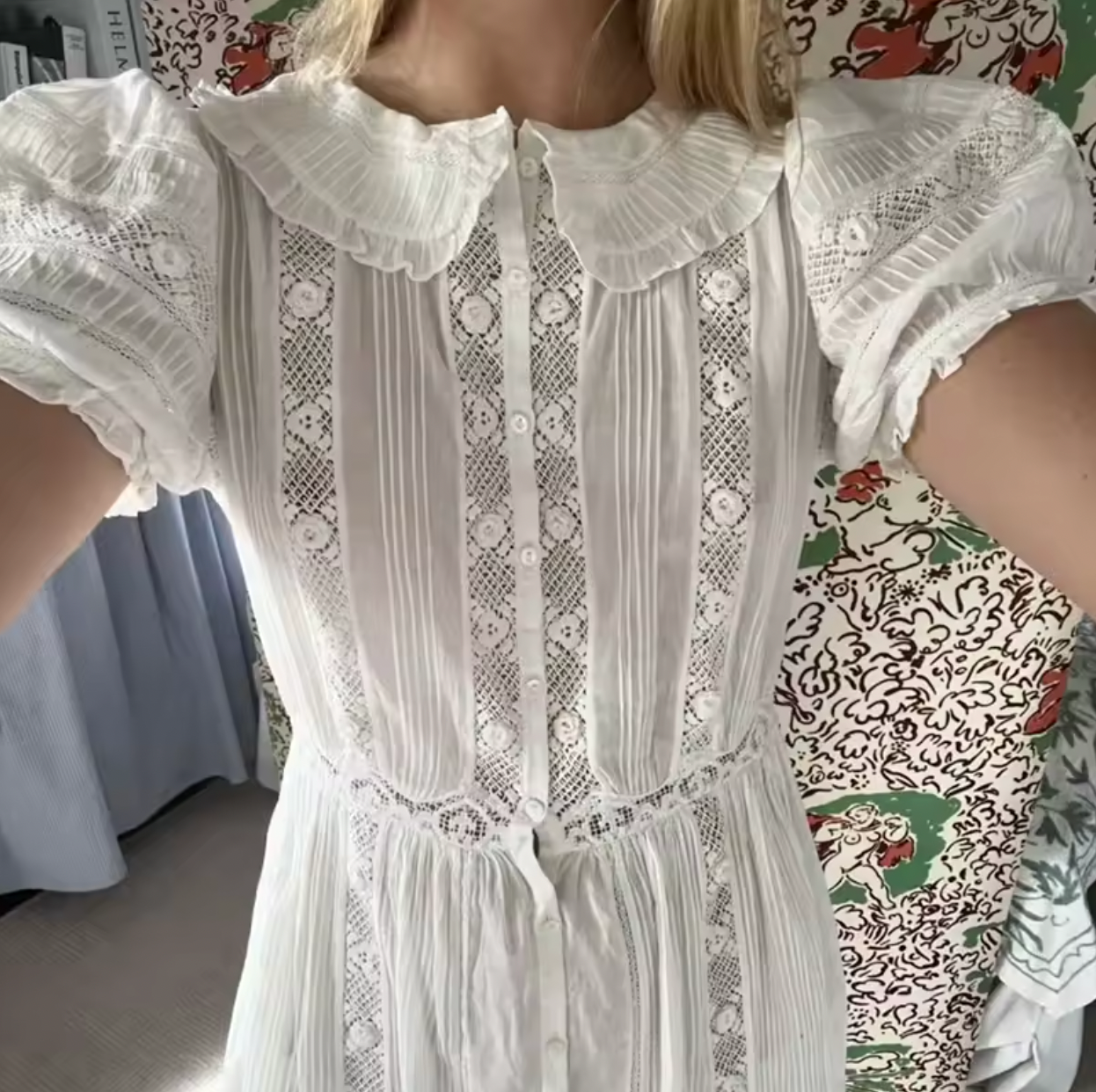 Indulge in timeless elegance with the Phoebe Lace Dress. Made from the softest organic cotton voile, it features delicate pintucks, inset lace, and a ruffled Peter Pan collar for a Victorian-inspired look. The fitted waist and mother-of-pearl buttons add a touch of sophistication, making it perfect for any occasion.