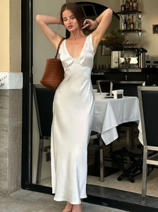 Elevate your evening look with the Allegra Satin Dress, a sleeveless, slim-fit gown designed to flatter your silhouette. Crafted from smooth satin, it features an elegant lace V-neckline and a high waist that enhances your figure. Perfect for sophisticated parties and special occasions, this dress combines timeless style with a touch of sensuality for a truly captivating presence.